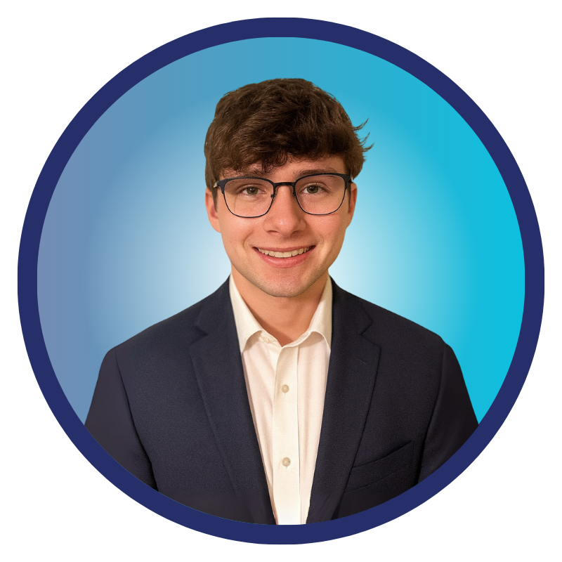 Tristen Barton in suit coat _Customer Success_Omni~View_headshot - blue background